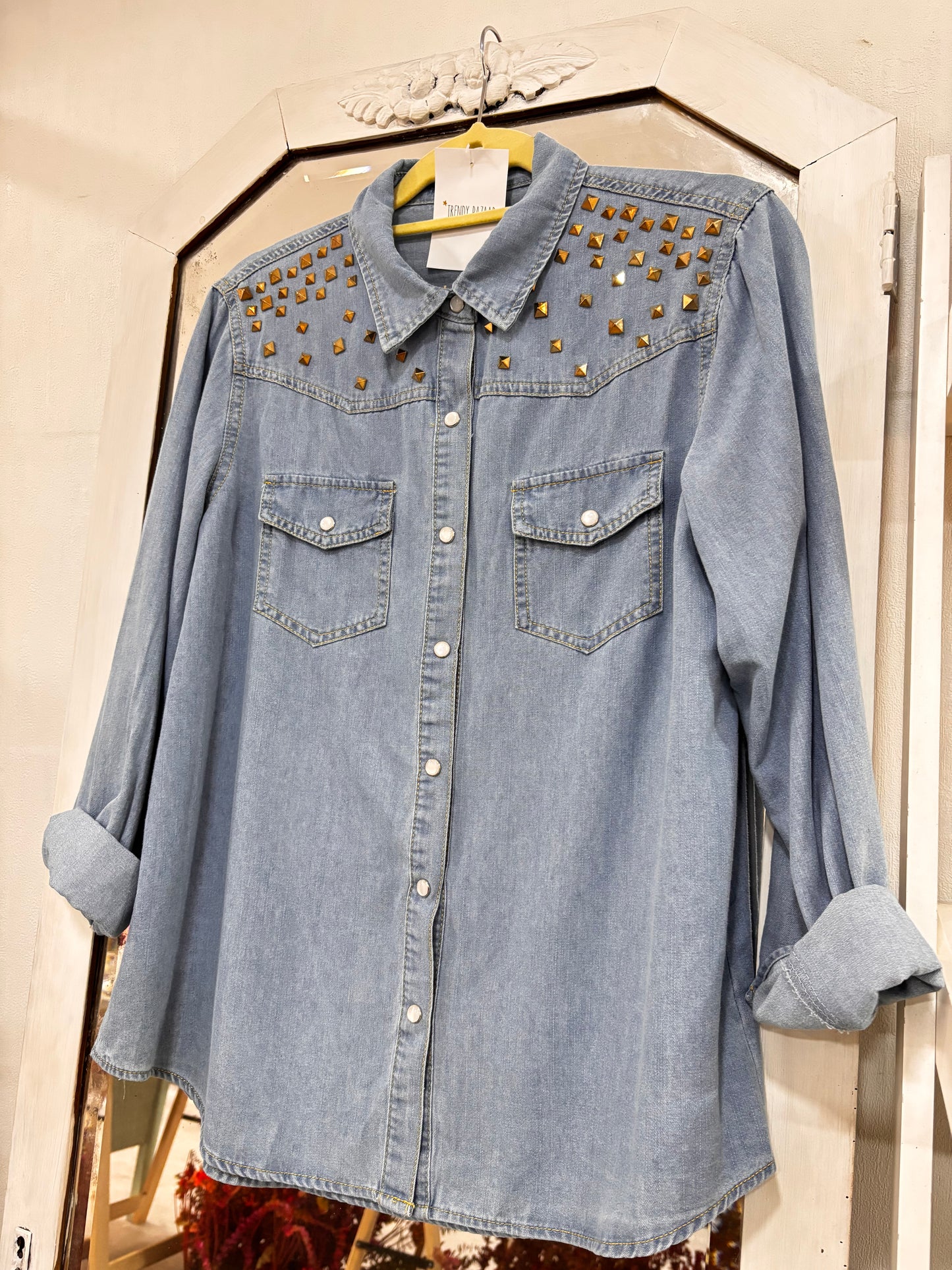 Denim shirt with shoulder appliqués