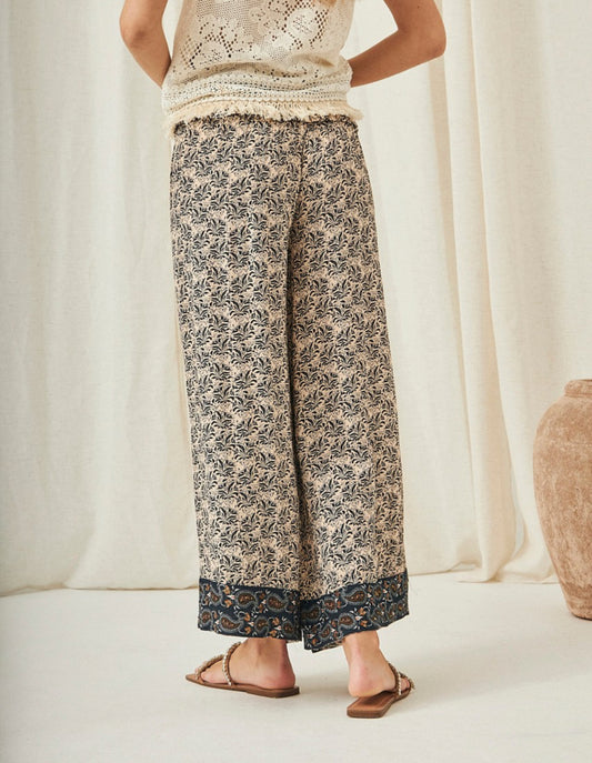Pantalones palazzo con estampado floral AU.Aretina