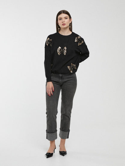 Camisola preta com laços e lantejoulas