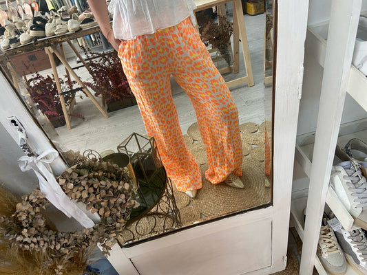 Calças animal print laranja/ amarelo
