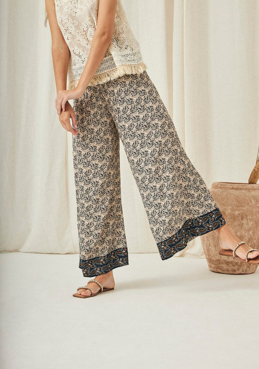 Pantalones palazzo con estampado floral AU.Aretina