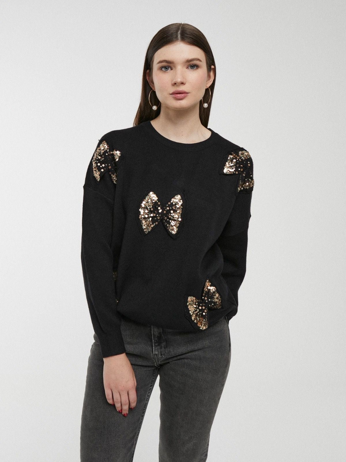 Camisola preta com laços e lantejoulas