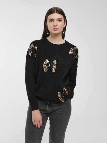 Camisola preta com laços e lantejoulas